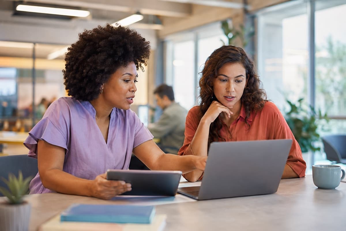 Customer-service and account specialists reviewing an ecommerce account request together